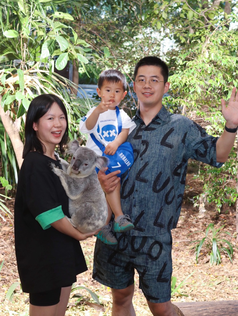 Yize with family and a koala
